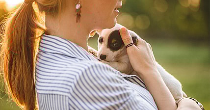 Woman with adopted puppy dog