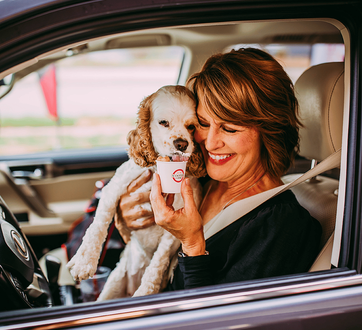 a pup and its mom at scooter's coffee